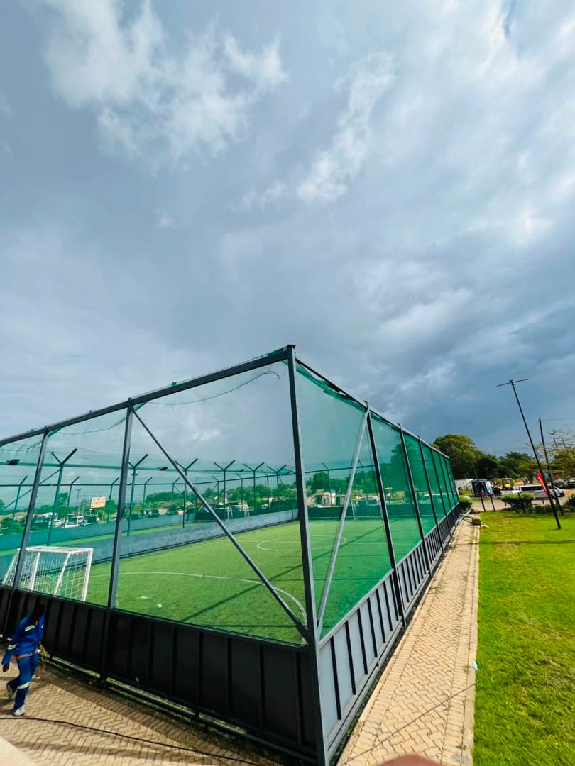 Side-on view of the caged pitch at Madokero